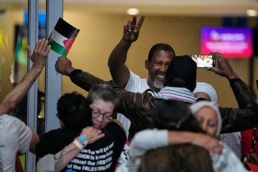 Mandla Mandela, showing victory sign and his fellow members of the Global Sumud Flotilla, at OR Tambo International Airport, in Johannesburg, South Africa, Wednesday, Oct. 8, 2025. (AP Photo/Themba Hadebe) Mandla Mandela, showing victory sign and his fellow members of the Global Sumud Flotilla, at OR Tambo International Airport, in Johannesburg, South Africa, Wednesday, Oct. 8, 2025. (AP Photo/Themba Hadebe)