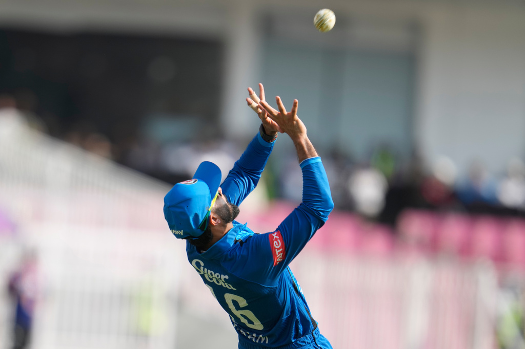 Afghanistan's Ikram Alikhil takes the catch to dismiss India's Ishan Kishan during the second ODI cricket match between India and Afghanistan in Lucknow, India, Wednesday, June 17, 2026. (AP Photo/Manish Swarup)