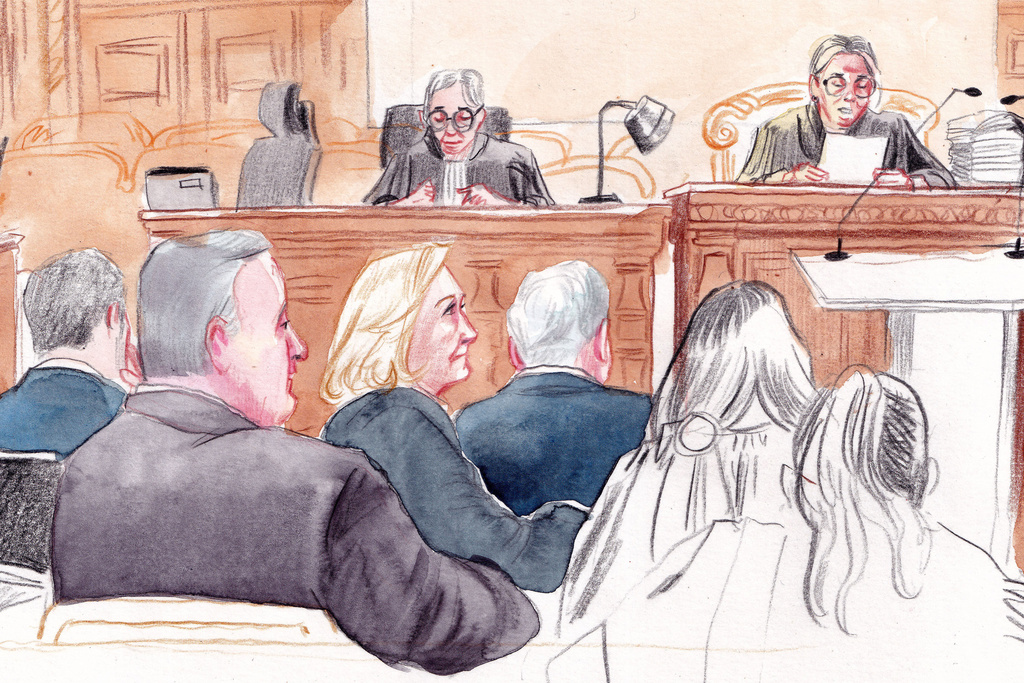 In this courtroom sketch, French far-right leader Marine Le Pen, center left, appears in court with other members of the far-right National Rally party, to appeal an embezzlement conviction that risks affecting her 2027 presidential ambitions Tuesday, Jan. 13, 1970 in Paris. (AP Photo/Valentin Pasquier)