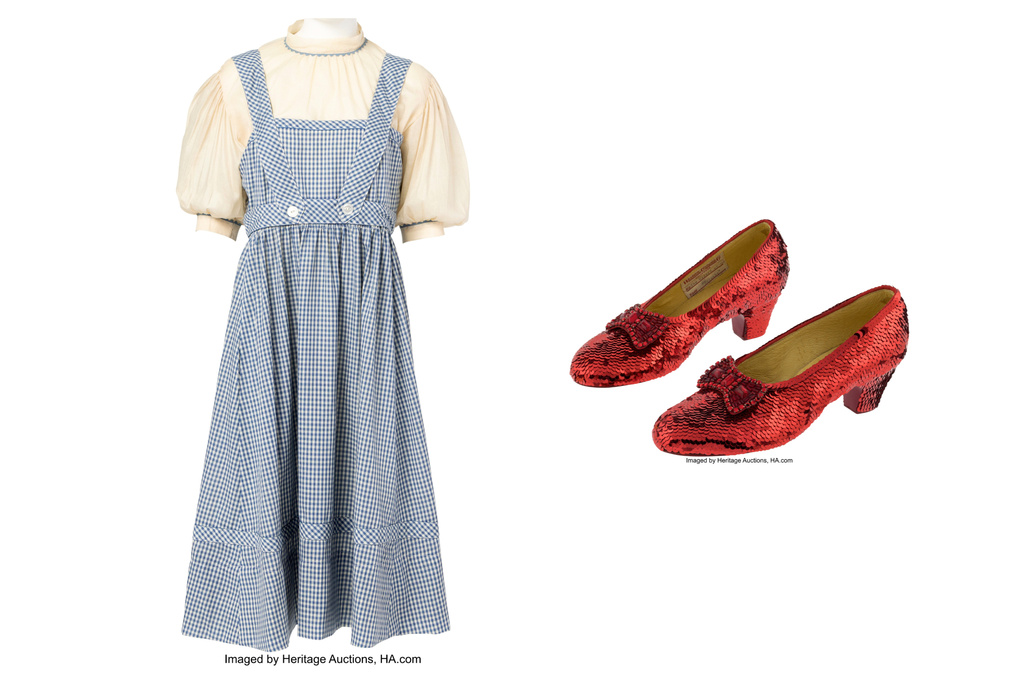 This combination of images shows the dress and ruby slippers, the costume for the character Dorothy in "The Wizard of Oz." (Heritage Auctions via AP)
