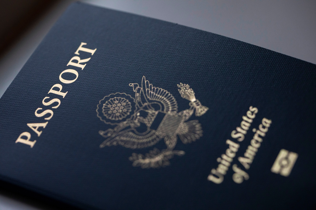 FILE - The cover of a U.S. Passport is displayed in Tigard, Ore., Saturday, Dec. 11, 2021. (AP Photo/Jenny Kane, File)