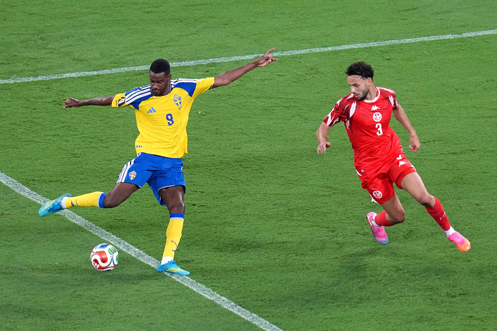 Sweden's Alexander Isak (9) shoots and scores their second goal against Tunisia's Montassar Talbi (3) during the World Cup Group F soccer match between Sweden and Tunisia in Guadalupe, near Monterrey, Mexico, Sunday, June 14, 2026. (AP Photo/Dolores Ochoa)