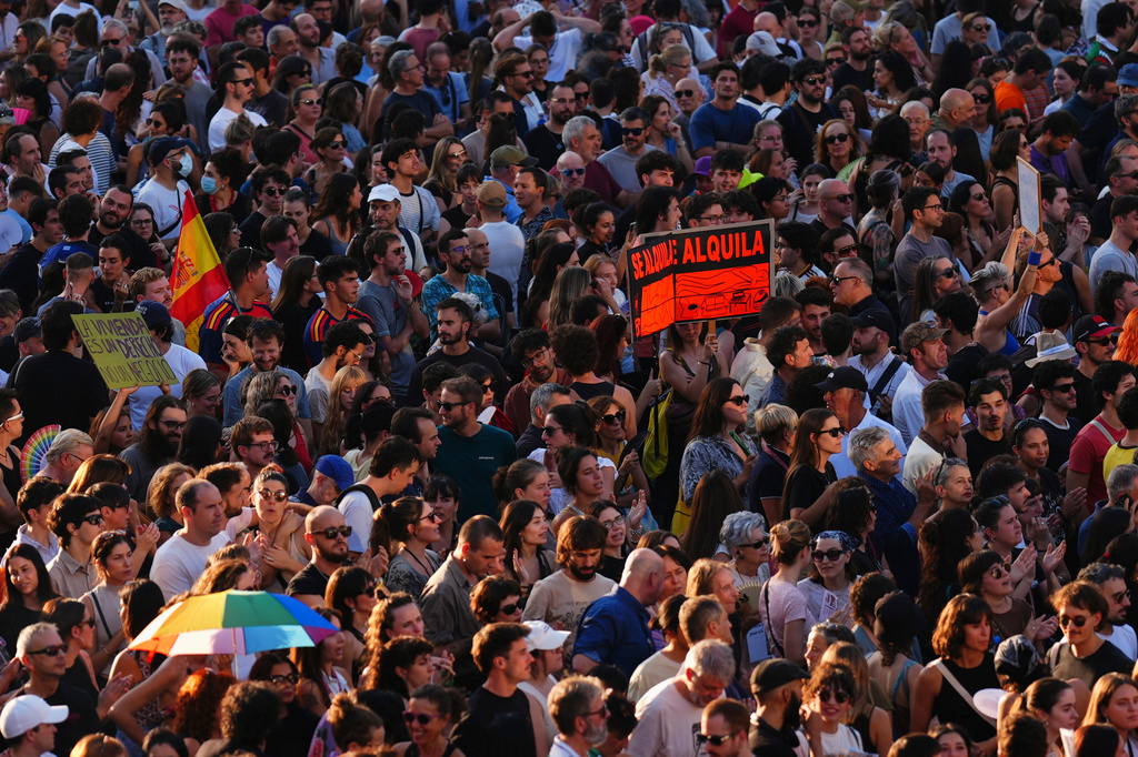 People gather during a protest following the eviction last Wednesday of 87-year-old Maricarmen to demand stronger laws to protect renters at Puerta del Sol in Madrid, Spain, Saturday, Sept. 26, 2026. (AP Photo/Manu Fernandez)
