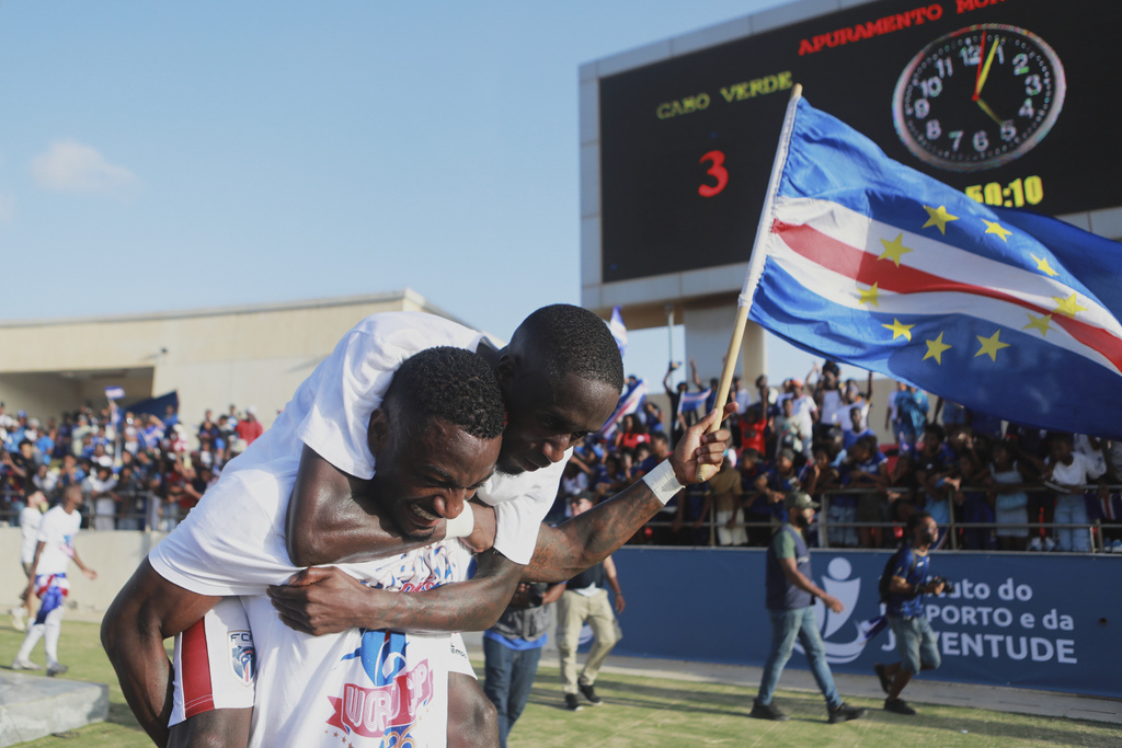 Cape Verde's Stopira, bottom, celebrates with his teammate after defeating Eswatini in a World Cup qualifying soccer match at Estádio Nacional in Praia, Cape Verde, Monday, Oct. 13, 2025, to clinch their qualification for the 2026 World Cup. (AP Photo/Cristiano Barbosa)