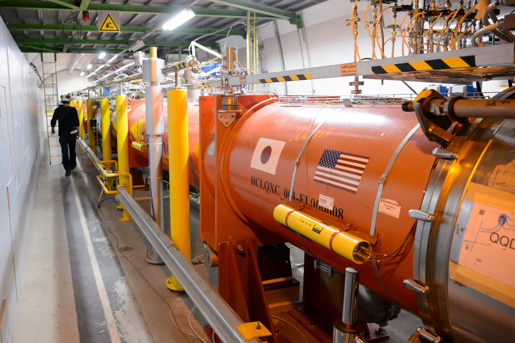 FILE - A technician works in the LHC (Large Hadron Collider) tunnel of the European Organization for Nuclear Research, CERN, during a press visit in Meyrin, near Geneva, Switzerland, Feb. 16, 2016. (Laurent Gillieron/Keystone via AP, File)