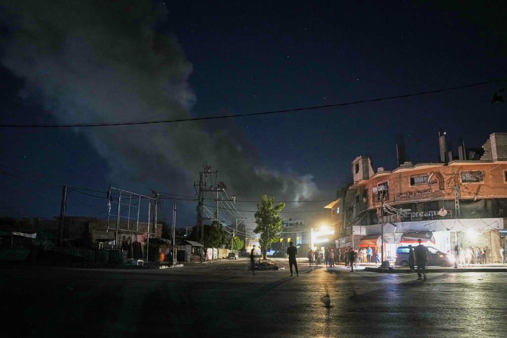 A plume of smoke rises following an Israeli military strike in Nuseirat, central Gaza Strip, Friday, July 31, 2026. (AP Photo/Abdel Kareem Hana)