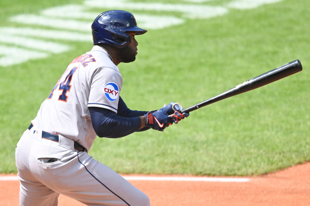 Houston Astros' Yordan Alvarez singles in the third inning of a baseball game against the Cleveland Guardians in Cleveland, Wednesday, April 22, 2026. (AP Photo/David Richard)