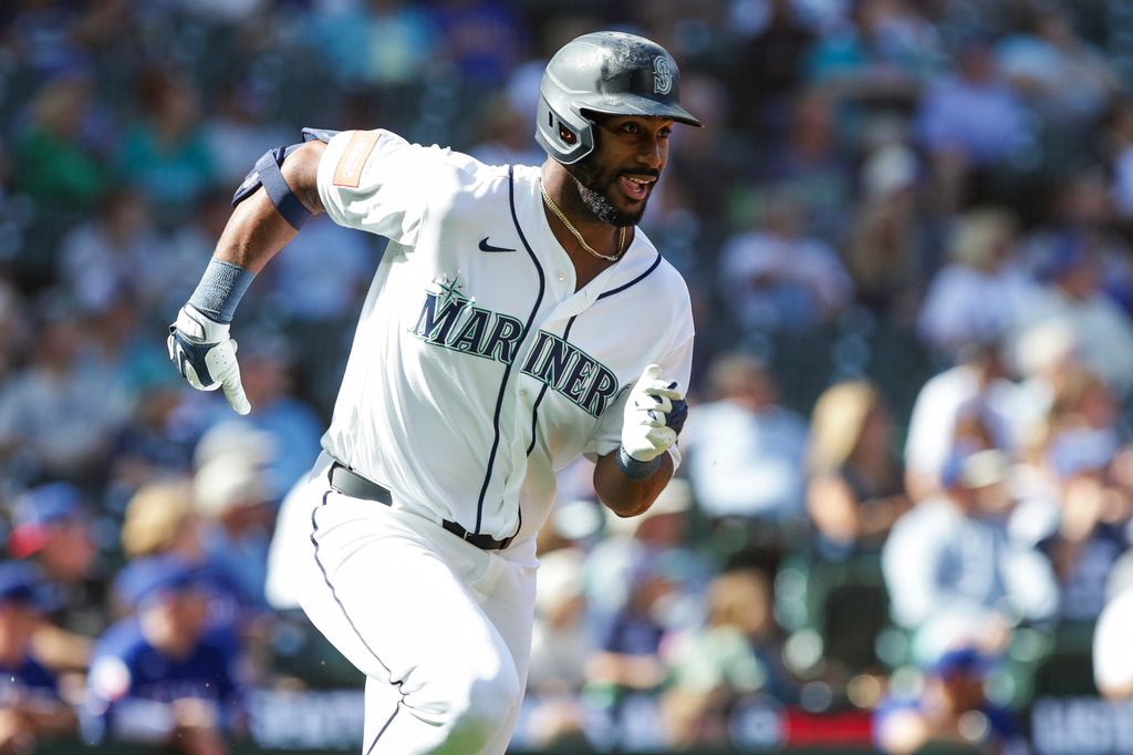 Seattle Mariners Lazaro Montes takes off from home after hitting a double off Texas Rangers relief pitcher Trevor Williams during the seventh inning of a baseball game, Wednesday, Sept. 9, 2026, in Seattle. (AP Photo/Jason Redmond)