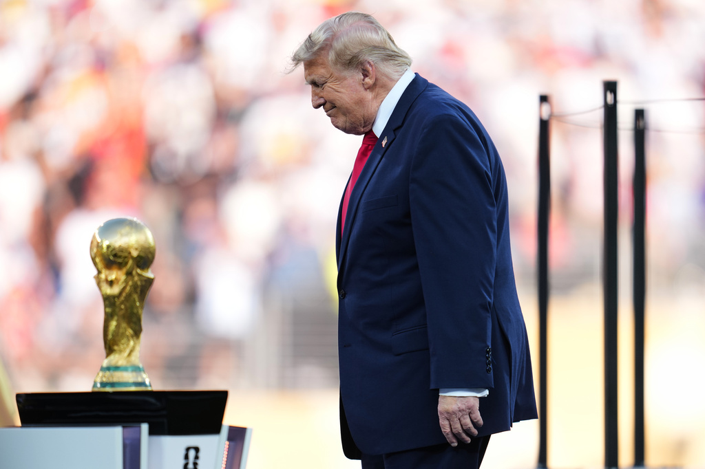 President Donald J. Trump walks onto the stage for the trophy presentation during the World Cup final soccer match between Spain and Argentina in East Rutherford, N.J., near New York, Sunday, July 19, 2026. (AP Photo/Abbie Parr)