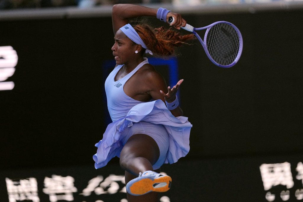 Coco Gauff of the U.S. plays a forehand return to Karolina Muchova of the Czech Republic during their fourth round match at the Australian Open tennis championship in Melbourne, Australia, Sunday, Jan. 25, 2026. (AP Photo/Asanka Brendon Ratnayake)