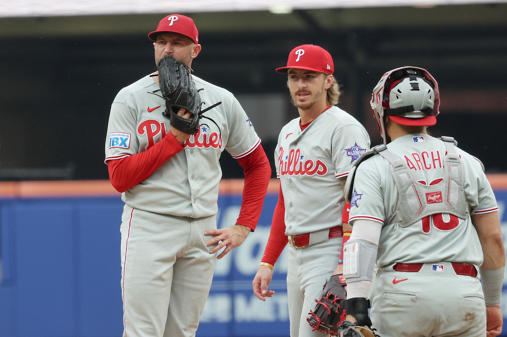 Philadelphia Phillies pitcher Tim Mayza, left, looks on as he is pulled during the second inning of a baseball game against the New York Mets, Saturday, June 27, 2026, in New York. (AP Photo/Heather Khalifa)