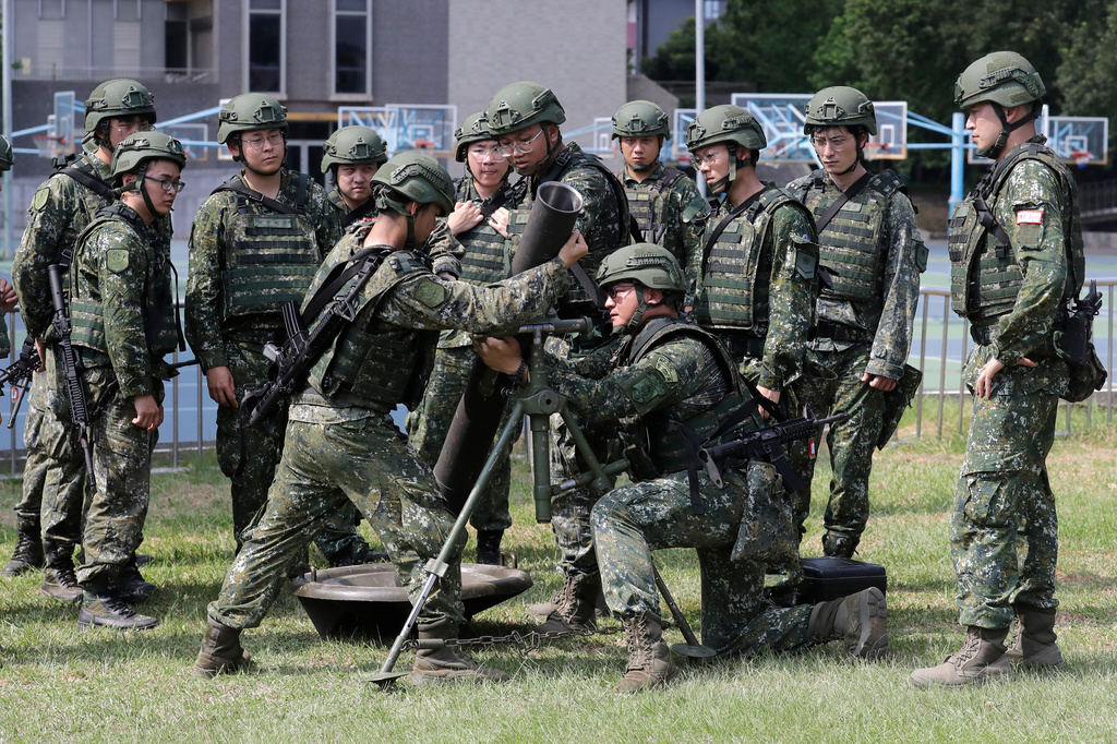 Soldiers conduct team training on a mortar during the annual Han Kuang military exercises in Taipei, Taiwan, Wednesday, Aug. 5, 2026. (AP Photo/Chiang Ying-ying)
