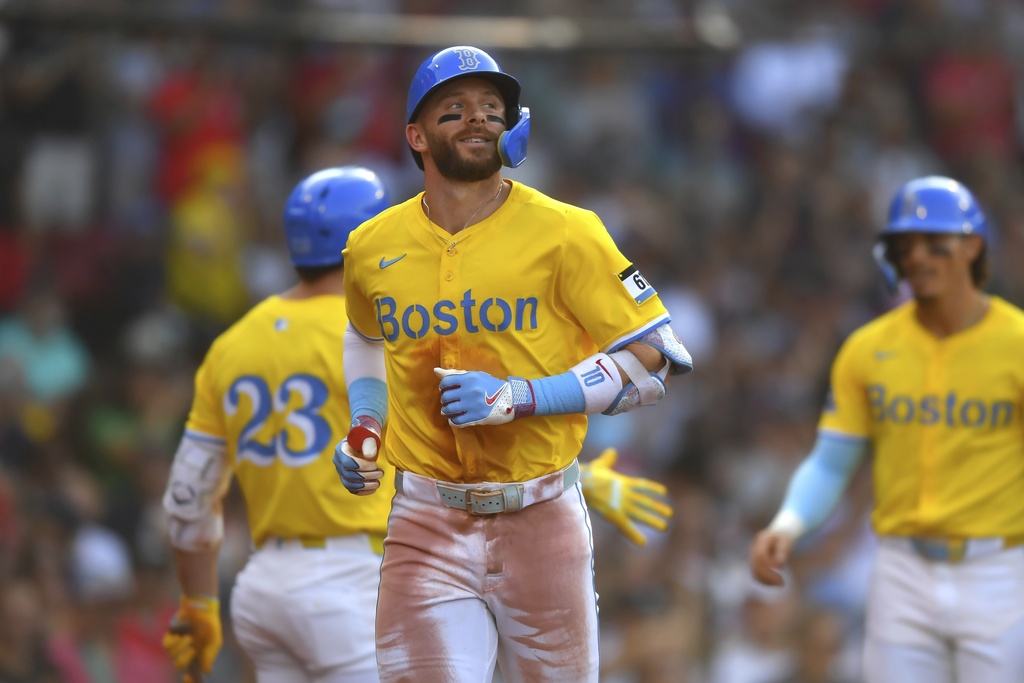 Boston Red Sox's Trevor Story, front, returns to the dugout after scoring on his three-run home run in the third inning of a baseball game against the Miami Marlins, Saturday, Aug. 16, 2025, in Boston. (Photo/Steven Senne)