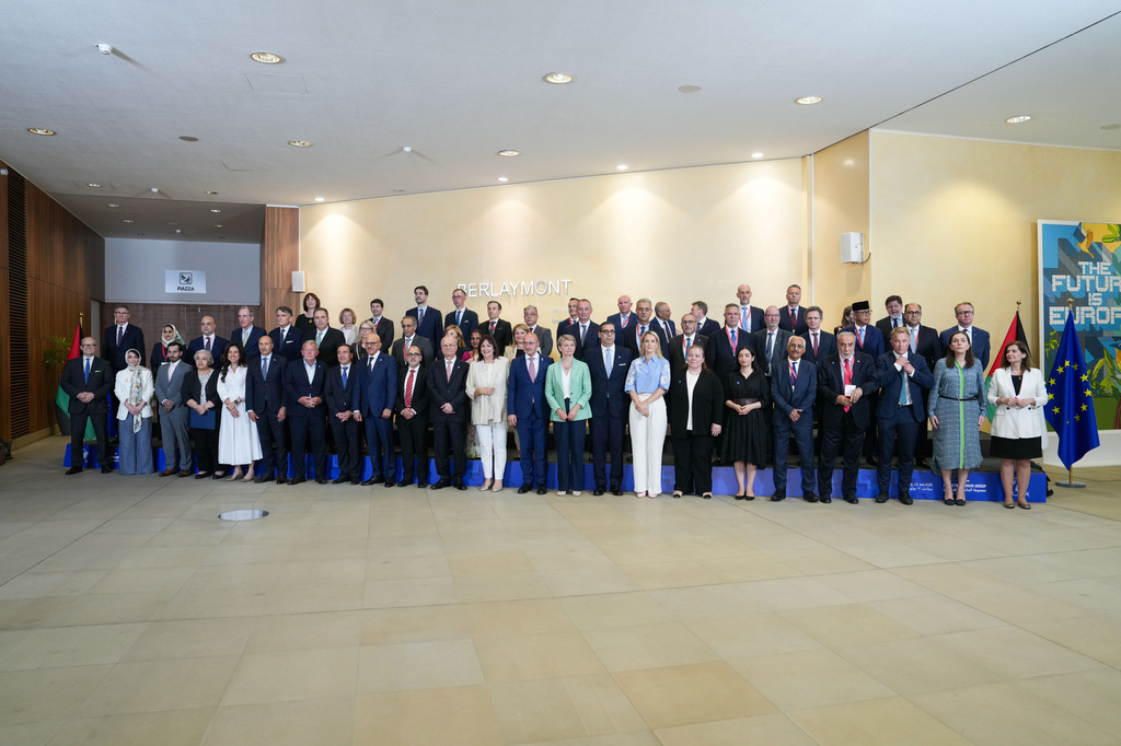 European Commissioner for the Mediterranean Dubravka Suica, front center right, and Palestinian Prime Minister Mohammad Mustafa, front center left, pose for a group photo with other officials at a Palestinian Donors Group meeting at EU headquarters in Brussels, Monday, July 13, 2026. (AP Photo/Marius Burgelman)
