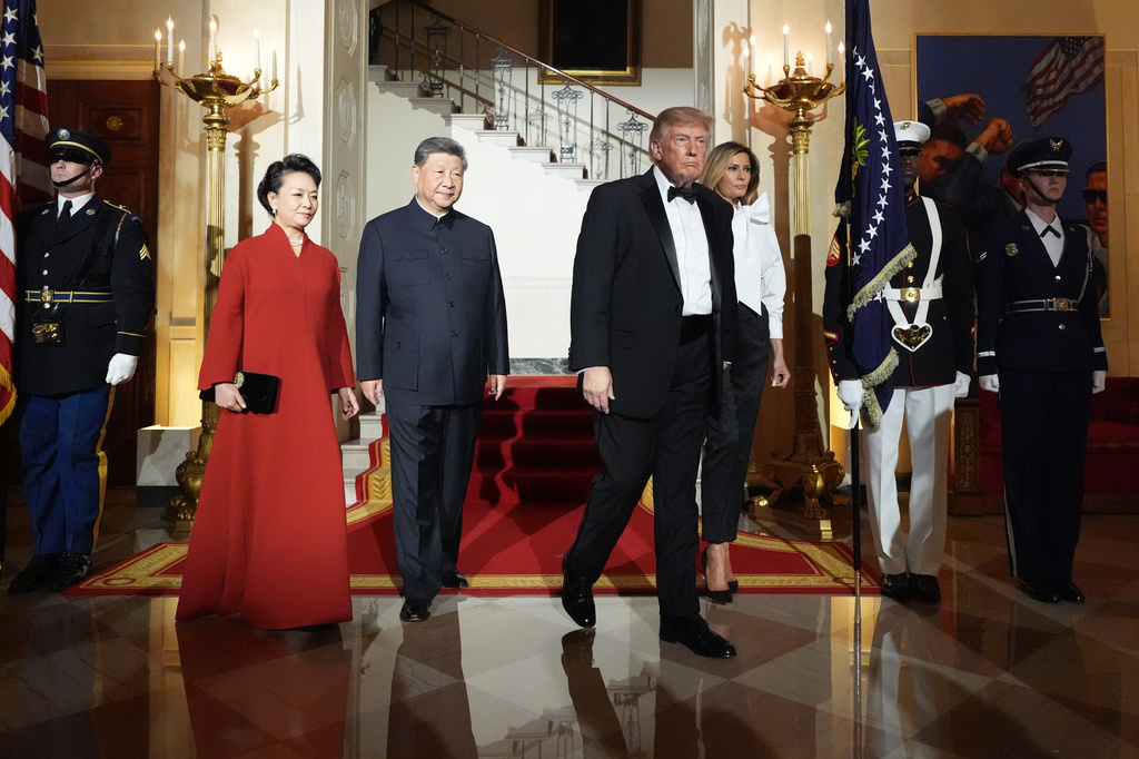 President Donald Trump and first lady Melania Trump walk with China's President Xi Jinping and his wife Peng Liyuan in the Grand Foyer of the White House during a State Dinner, Thursday, Sept. 24, 2026, in Washington. (AP Photo/Alex Brandon)