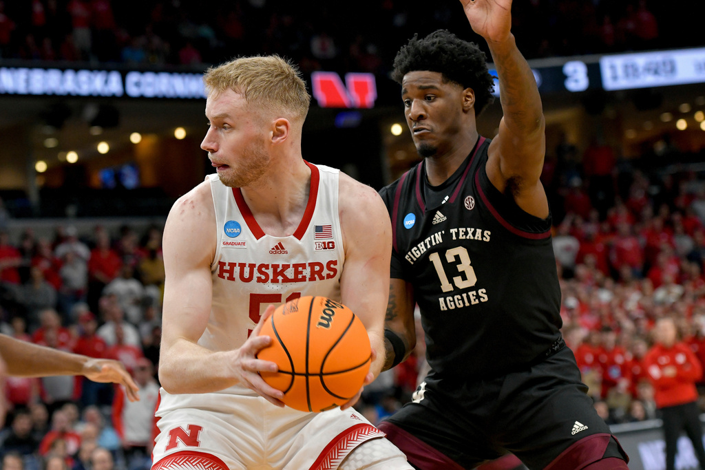 FILE - Nebraska forward Rienk Mast (51) looks to pass the ball away from Texas A&amp;M forward Solomon Washington (13) during the first half of a first-round college basketball game in the NCAA Tournament, March 22, 2024, in Memphis, Tenn. (AP Photo/Brandon Dill, file)