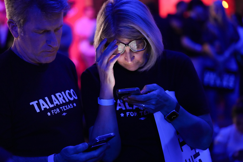 Supporters of Texas state Rep. James Talarico, D-Austin, a Democratic candidate for the U.S. Senate, watch results come in on their phones during a primary election watch party Tuesday, March 3, 2026, in Austin, Texas. (AP Photo/Eric Gay)