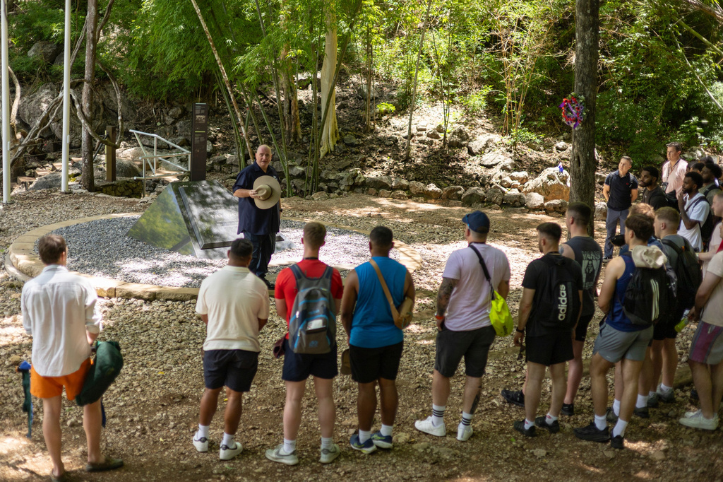 Mick Clarke, the manager of the Hellfire Pass Interpretive Centre, speaks to visitors at the infamous section of the World War II "Death Railway," in Sai Yok, Thailand, Sunday, May 31, 2026. (AP Photo/Anton L. Delgado)
