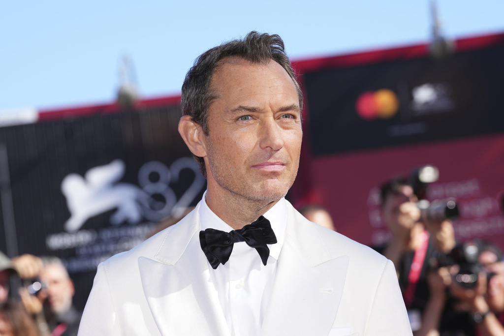 Jude Law poses for photographers at the red carpet for the film 'The Wizard of the Kremlin' during the 82nd edition of the Venice Film Festival in Venice, Italy, on Sunday, Aug. 31, 2025. (Photo by Scott A Garfitt/Invision/AP)