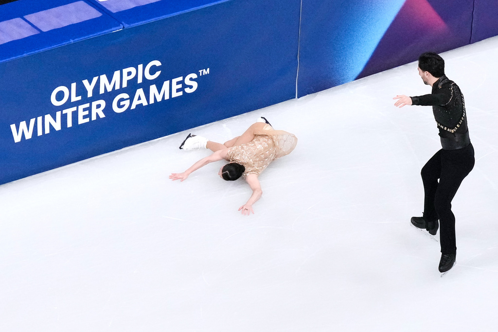 Deanna Stellato-Dudek and Maxime Deschamps of Canada compete during the pairs figure skating short program at the 2026 Winter Olympics, in Milan, Italy, Sunday, Feb. 15, 2026. (AP Photo/Bernat Armangue)
