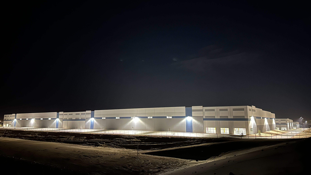 A massive 826,780-square-foot warehouse sits illuminated Feb. 12, 2026, in the El Paso suburb of Socorro, Texas, that was recently purchased by the U.S. Department of Homeland Security for $122.8 million. (ASP Photo/Morgan Lee)