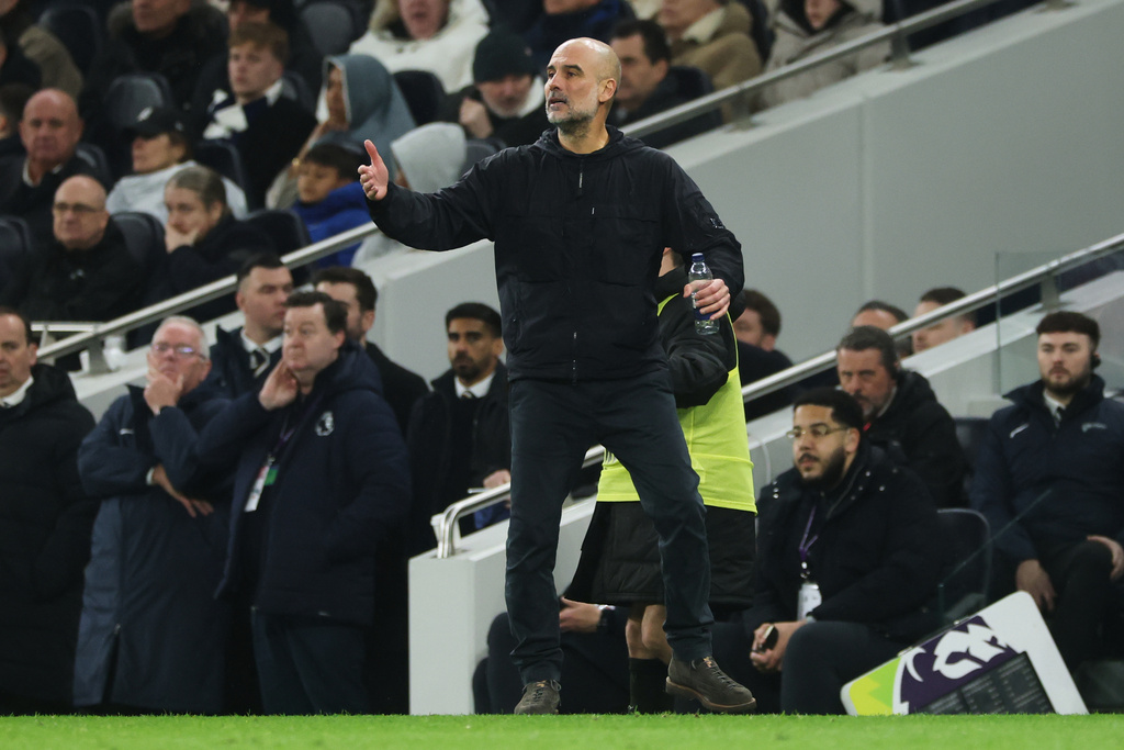 Manchester City's head coach Pep Guardiola reacts during the English Premier League soccer match between Tottenham Hotspur and Manchester City in London, Sunday, Feb. 1, 2026. (AP Photo/Richard Pelham)