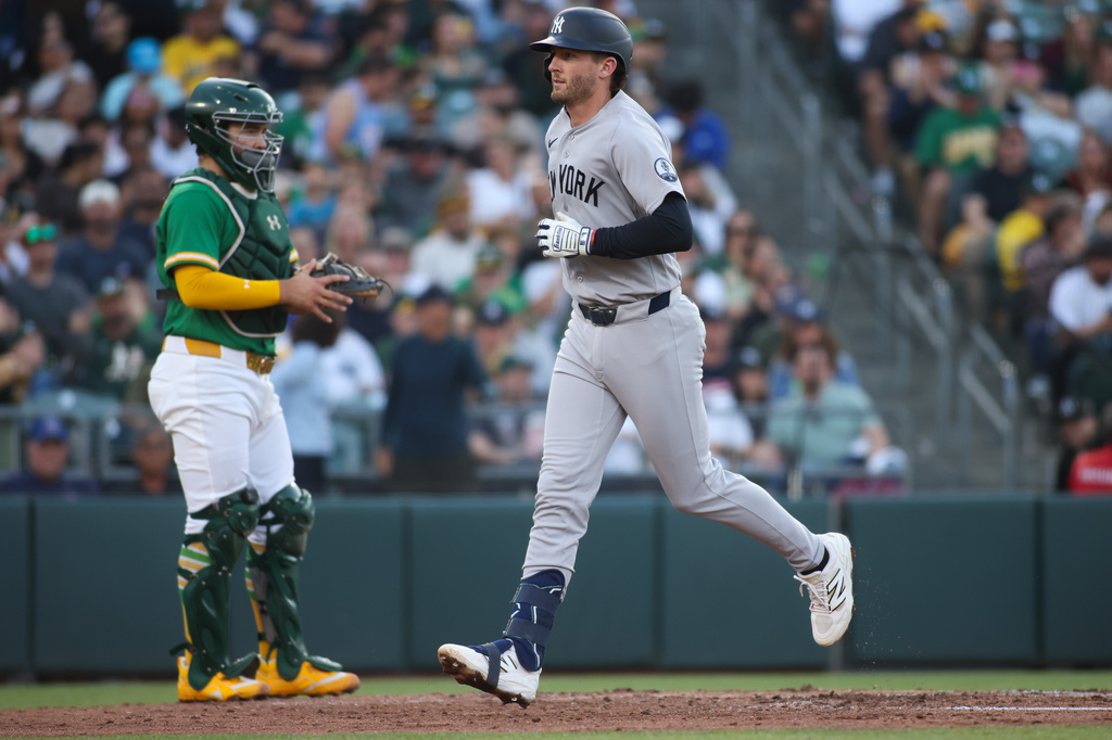 New York Yankees' Ryan McMahon heads to the dugout after hitting a solo home run during the third inning of a baseball game against the Athletics Friday, May 29, 2026, in West Sacramento, Calif. (AP Photo/Scott Marshall)