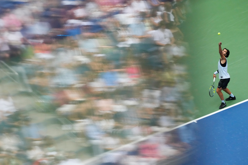 Carlos Alcaraz, of Spain, serves the ball to Tommy Paul, of the United States, during the fourth round of the U.S. Open tennis championships Sunday, Sept. 6, 2026, in New York. (AP Photo/Yuki Iwamura)