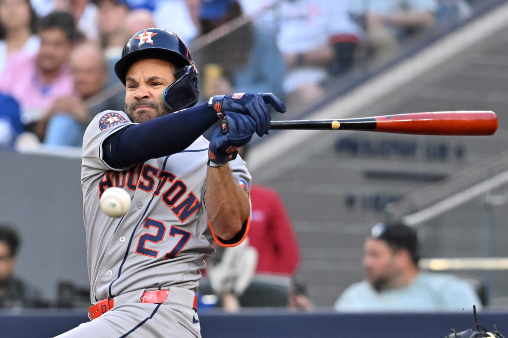Houston Astros' Jose Altuve fouls off a pitch during the first inning of a baseball game against the Toronto Blue Jays, in Toronto, Monday, June 22, 2026. (Jon Blacker/The Canadian Press via AP)