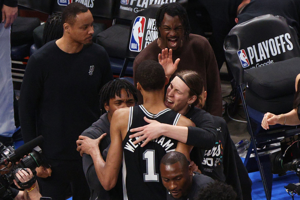San Antonio Spurs forward Victor Wembanyama (1) celebrates with teammates after winning Game 1 in a third-round NBA basketball playoffs series against the Oklahoma City Thunder Monday, May 18, 2026, in Oklahoma City. (AP Photo/Nate Billings)