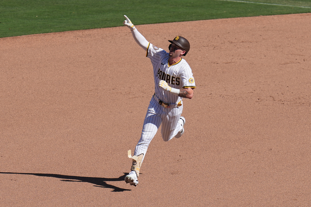 San Diego Padres' Jackson Merrill celebrates after hitting a home run during the sixth inning of a baseball game against the Milwaukee Brewers Wednesday, Sept. 24, 2025, in San Diego. (AP Photo/Gregory Bull)