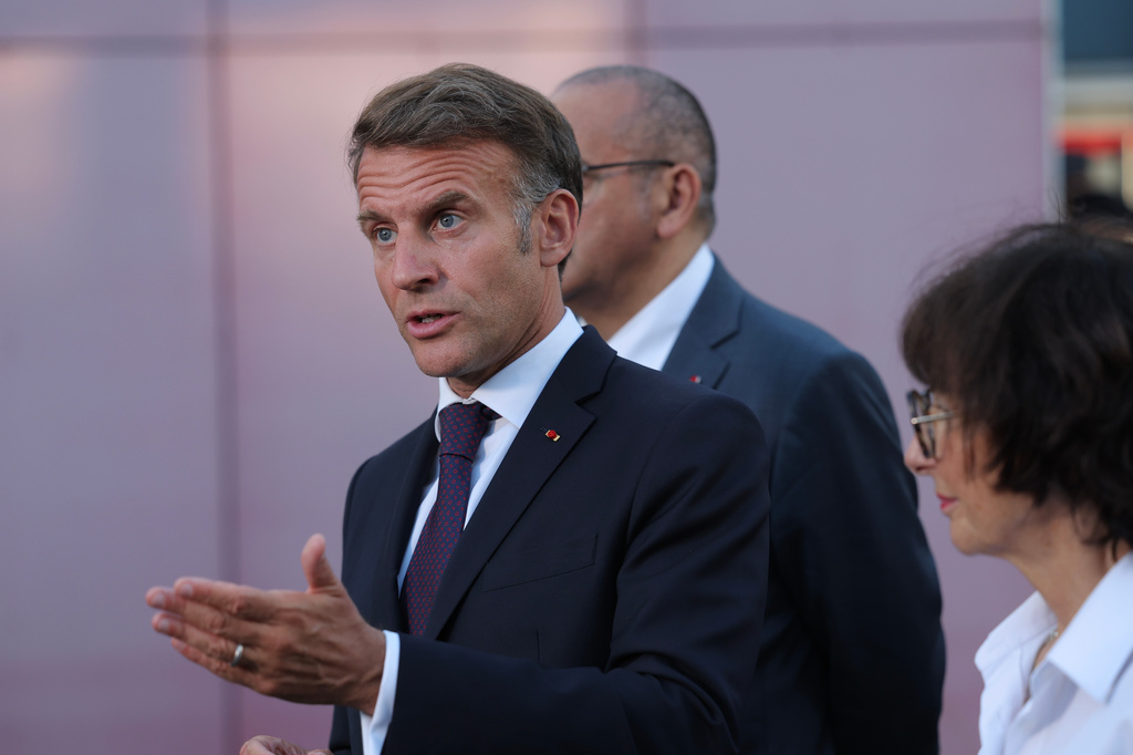 France's President Emmanuel Macron speaks to the press after a visit to the departmental fire and rescue operational center (CODIS) in Bordeaux, France, following wildfires in the area, Monday July 27, 2026. (Kenzo Tribouillard/Pool Photo via AP)