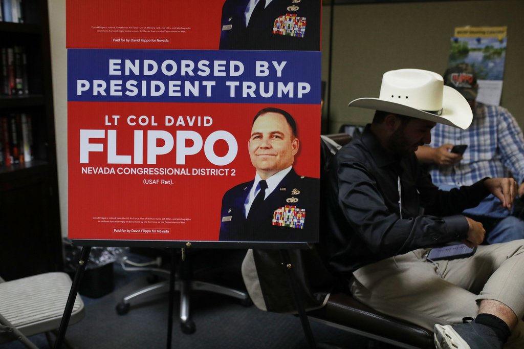 Attendees sit during a primary election night watch party for David Flippo, a Republican candidate for Congress in Nevada's 2nd district, Tuesday, June 9, 2026, in Reno, Nev. (AP Photo/William Hale Irwin)