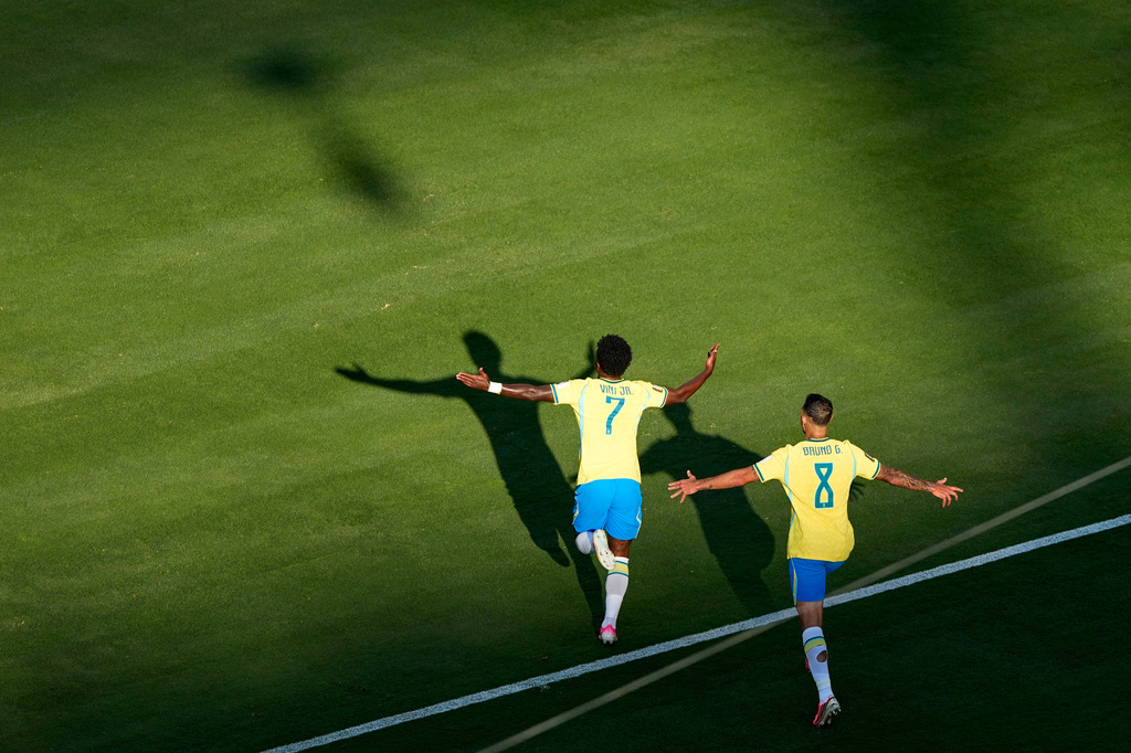 Brazil's Vinicius Junior (7) celebrates after scoring as teammate Bruno Guimaraes (8) watches during the World Cup Group C soccer match against Morocco in East Rutherford, N.J., near New York, Saturday, June 13, 2026. (AP Photo/Matt Slocum)