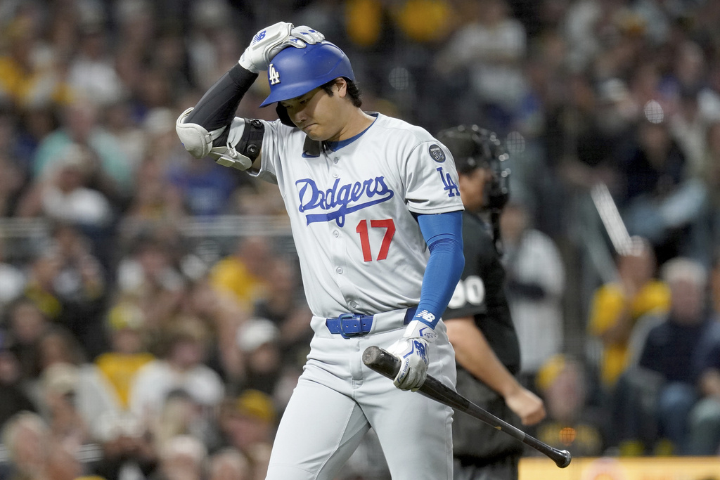 Los Angeles Dodgers' Shohei Ohtani walks to the dugout after striking out during the sixth inning of a baseball game against the Pittsburgh Pirates Thursday, Sept. 4, 2025, in Pittsburgh. (AP Photo/Matt Freed)