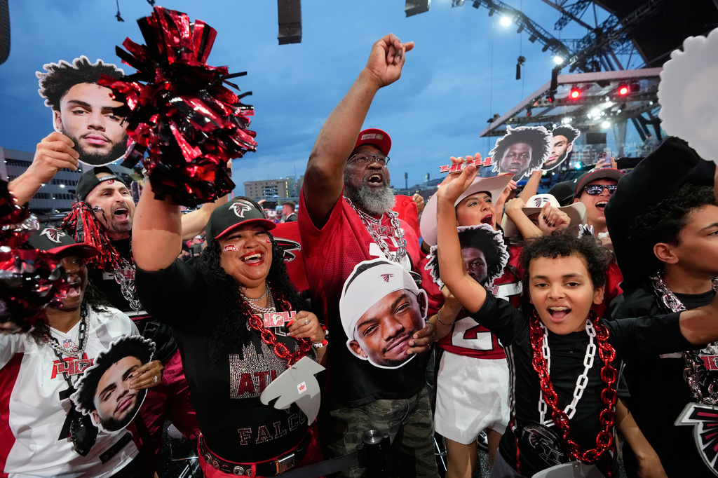 Atlanta Falcons fans cheer during the second round of the NFL football draft, Friday, April 24, 2026, in Pittsburgh. (AP Photo/Sue Ogrocki)