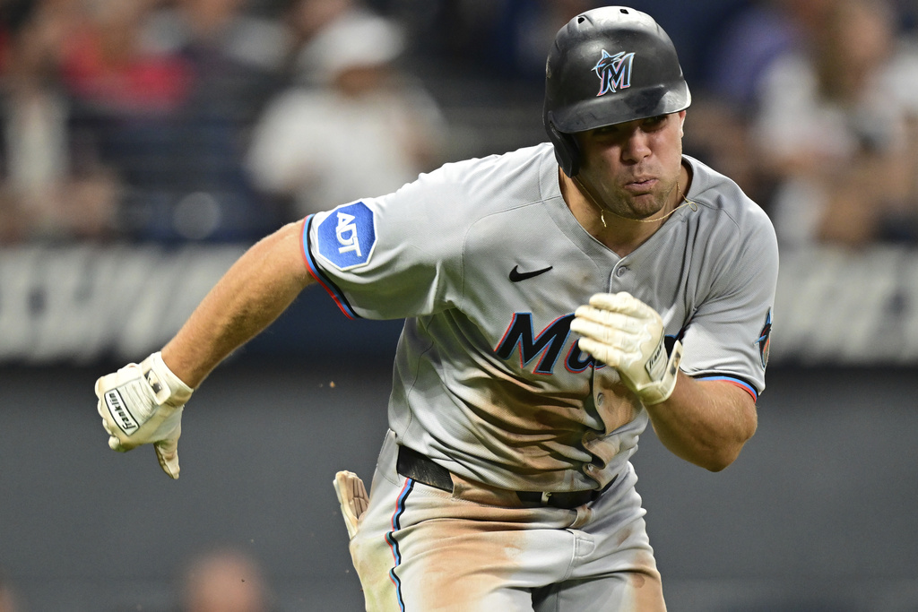Miami Marlins' Jakob Marsee runs after hitting a two-RBI double during the sixth inning of a baseball game against the Cleveland Guardians, Wednesday, Aug. 13, 2025, in Cleveland. (AP Photo/David Dermer)