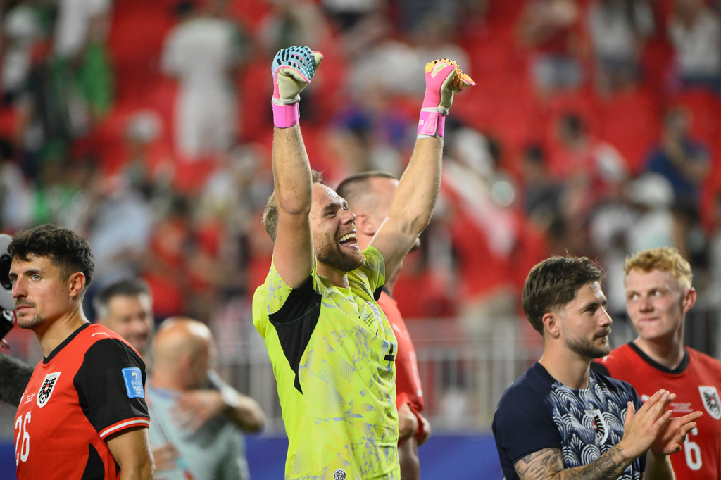 Austria goalkeeper Alexander Schlager (1) celebrates after the World Cup Group J soccer match between Algeria and Austria in Kansas City, Mo., Saturday, June 27, 2026. (AP Photo/Reed Hoffmann)