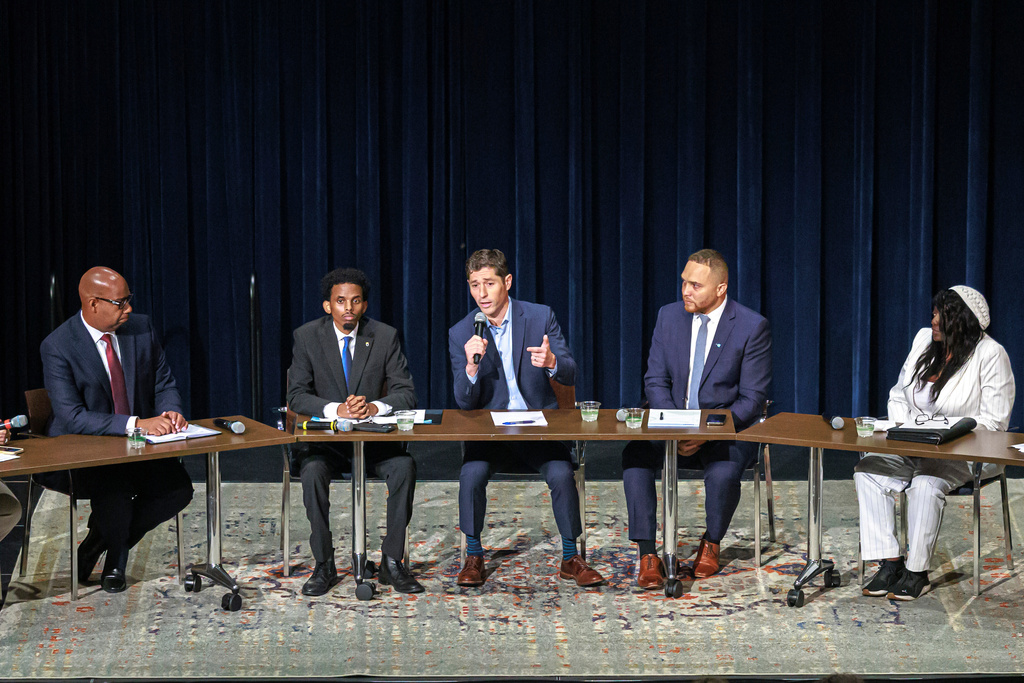 Minneapolis mayoral candidates, from left, DeWayne Davis, Omar Fateh, Jacob Frey, Jazz Hampton and Brenda Short attend the Minneapolis Mayoral Debate at Westminster Hall at Westminster Presbyterian Church on Sept. 26, 2025, in Minneapolis. (Kerem Yücel/Minnesota Public Radio via AP)