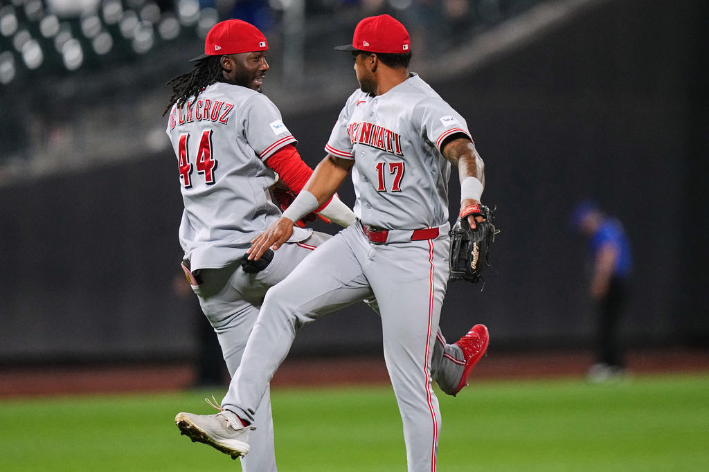 Cincinnati Reds' Elly de la Cruz (44) celebrates with Dane Myers (17) after a baseball game against the New York Mets Tuesday, May 26, 2026, in New York. (AP Photo/Frank Franklin II)
