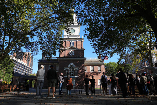 Tourist view Independence Hall from outside a barricade in Philadelphia, Wednesday, Oct. 1, 2025. (AP Photo/Matt Rourke) Tourist view Independence Hall from outside a barricade in Philadelphia, Wednesday, Oct. 1, 2025. (AP Photo/Matt Rourke)