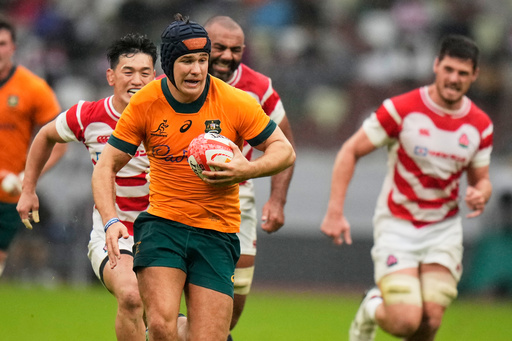 Australia's Josh Flook runs to scores a try during a rugby test between the Wallabies and Japan in Tokyo, Saturday, Oct. 25, 2025. (AP Photo/Shuji Kajiyama) Australia's Josh Flook runs to scores a try during a rugby test between the Wallabies and Japan in Tokyo, Saturday, Oct. 25, 2025. (AP Photo/Shuji Kajiyama)