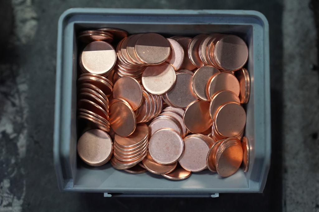 Blank coins wait to be the last pennies pressed at the U.S. Mint in Philadelphia, Wednesday, Nov. 12, 2025. (AP Photo/Matt Slocum)