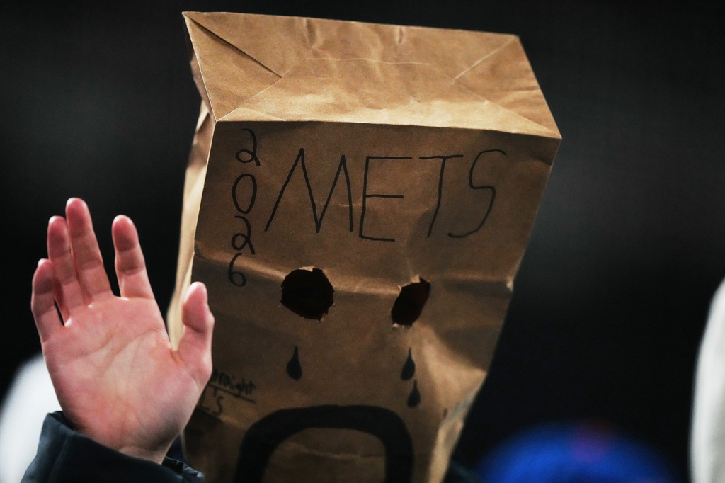 A New York Mets fan watches during the eighth inning of a baseball game against the Minnesota Twins Tuesday, April 21, 2026, in New York. (AP Photo/Frank Franklin II)