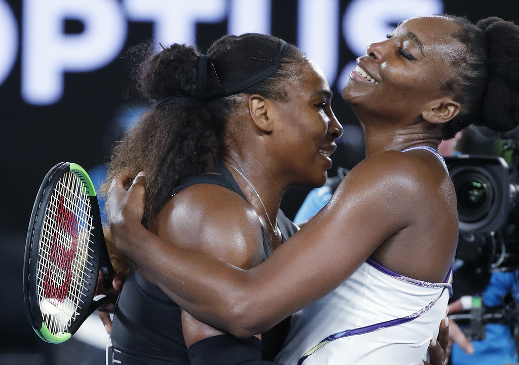 FILE - United States' Serena Williams, left, embraces her sister, Venus, as she celebrates after winning the women's singles final at the Australian Open tennis championships in Melbourne, Australia, Saturday, Jan. 28, 2017. (AP Photo/Dita Alangkara, File)