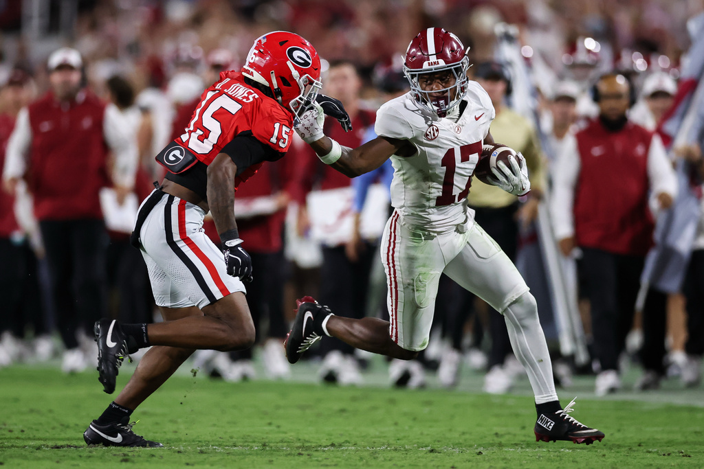 Alabama wide receiver Lotzeir Brooks (17) looks to stiff-arm Georgia defensive back Demello Jones (15) during the first half of an NCAA college football game, Saturday, Sept. 27, 2025, in Athens, Ga. (AP Photo/Colin Hubbard)