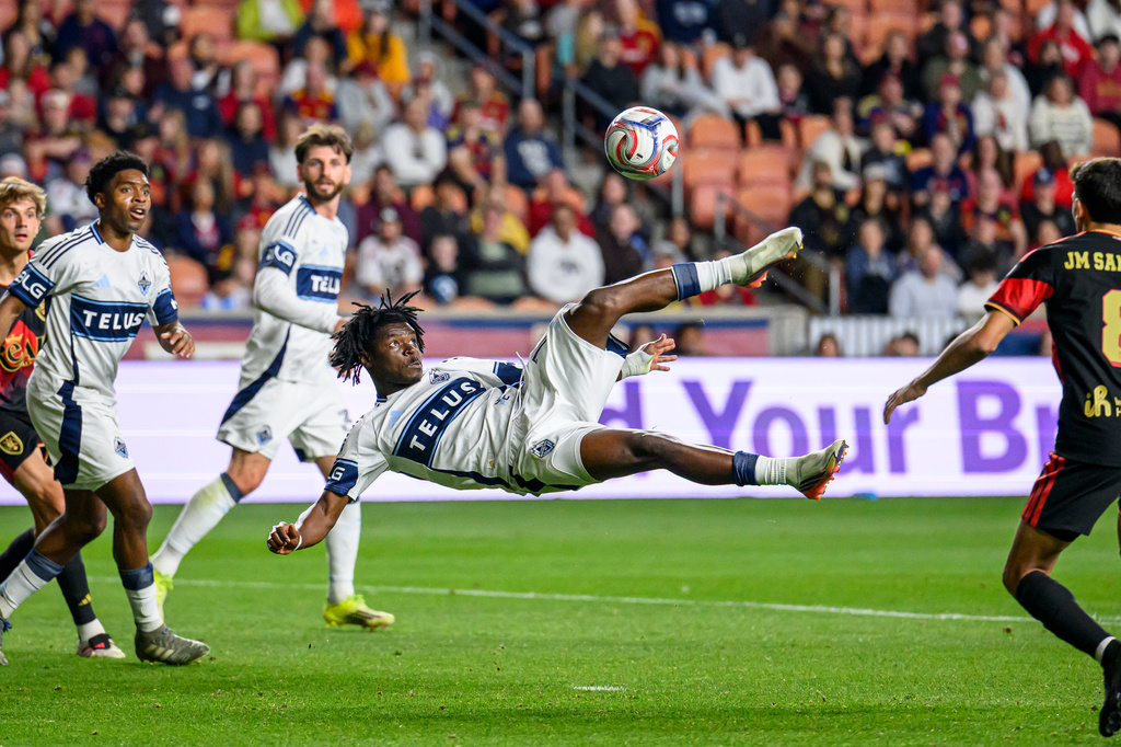 Vancouver Whitecaps forward Emmanuel Sabbi, center, bicycle kicks the ball on goal during an MLS soccer match against Real Salt Lake, Saturday, Sept. 19, 2026, in Sandy, Utah. (AP Photo/Tyler Tate)