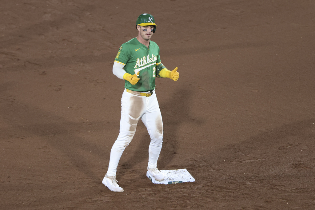 Athletics' Brent Rooker gives a thumbs-up after hitting a double during the fifth inning of a baseball game against the Detroit Tigers, Tuesday, Aug. 26, 2025, in West Sacramento, Calif. (AP Photo/Scott Marshall)
