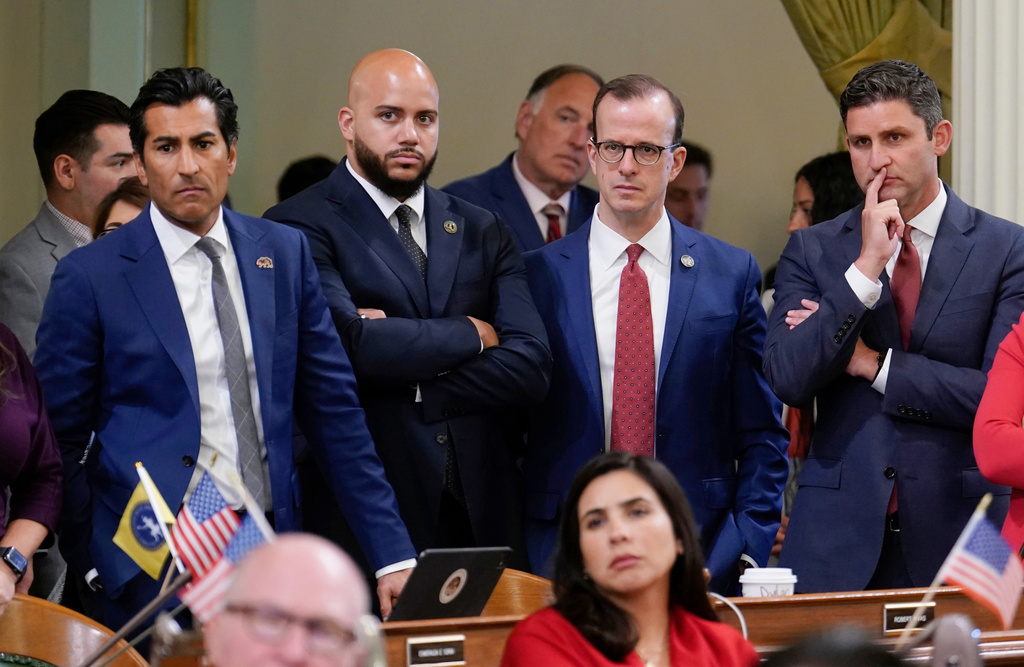 FILE - California Assembly Speaker Robert Rivas, left, along with fellow Democratic Assembly members Isaac Bryan, second from left, Marc Berman, third from left and Jesse Gabriel, right, listen to the debate over a package of measures to redraw the state's Congressional districts and put new maps before voters in a special election, during the Assembly session at the Capitol in Sacramento, Calif.., Aug. 21, 2025. (AP Photo/Rich Pedroncelli, File)