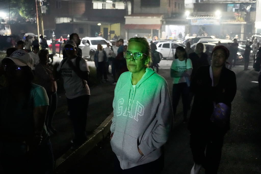 Mariana Gonzalez, the daughter of opposition leader Edmundo Gonzalez, whose husband is detained, waits outside the Rodeo I prison in Guatire, Venezuela, Thursday, Jan. 8, 2026, after National Assembly President Jorge Rodriguez said the government would release Venezuelan and foreign prisoners. (AP Photo/Matias Delacroix)